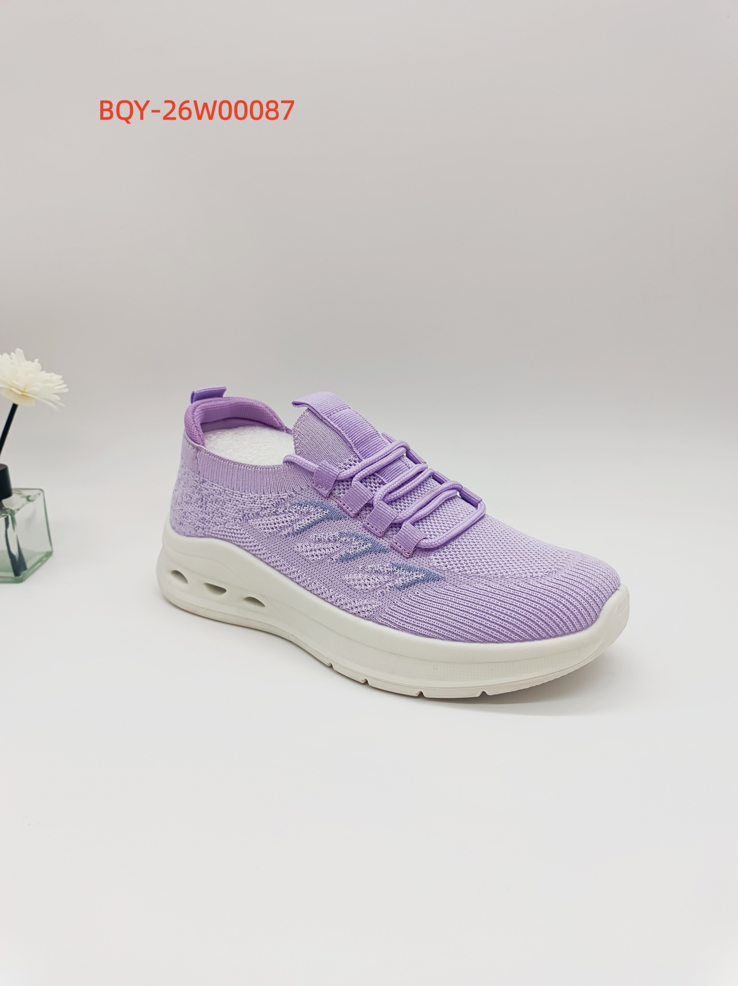 Purple knit footwear sample for regional market selection